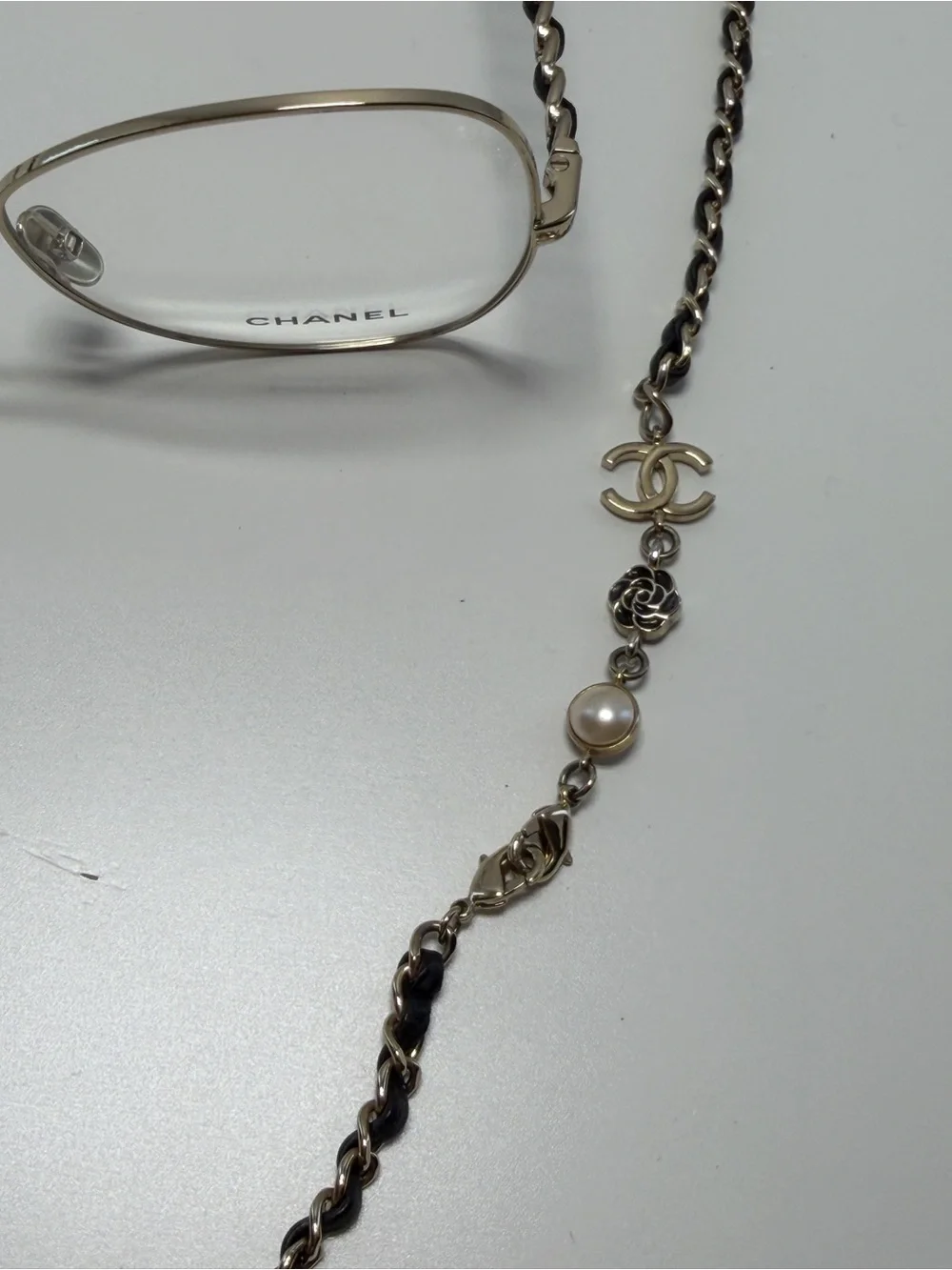 CHANEL  Gold and Black Eye ear Chain with Silver-Tone Glasses